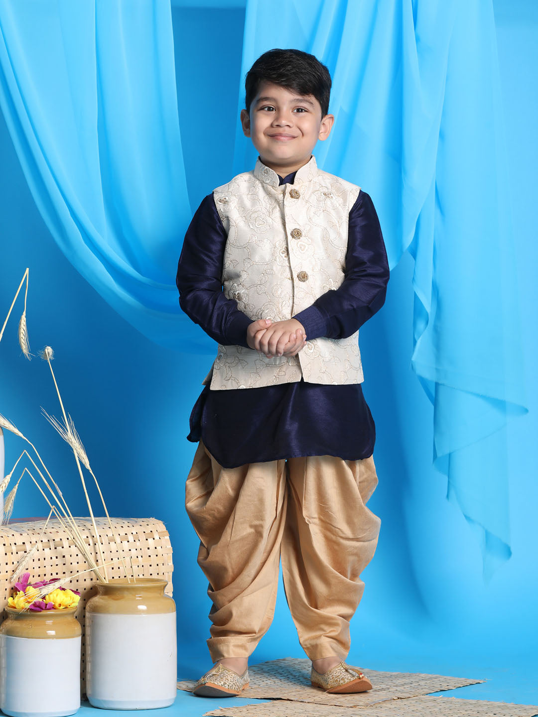 Vastramay boys beige embroidered nehru jacket with navy blue kurta and rose gold dhoti set 1