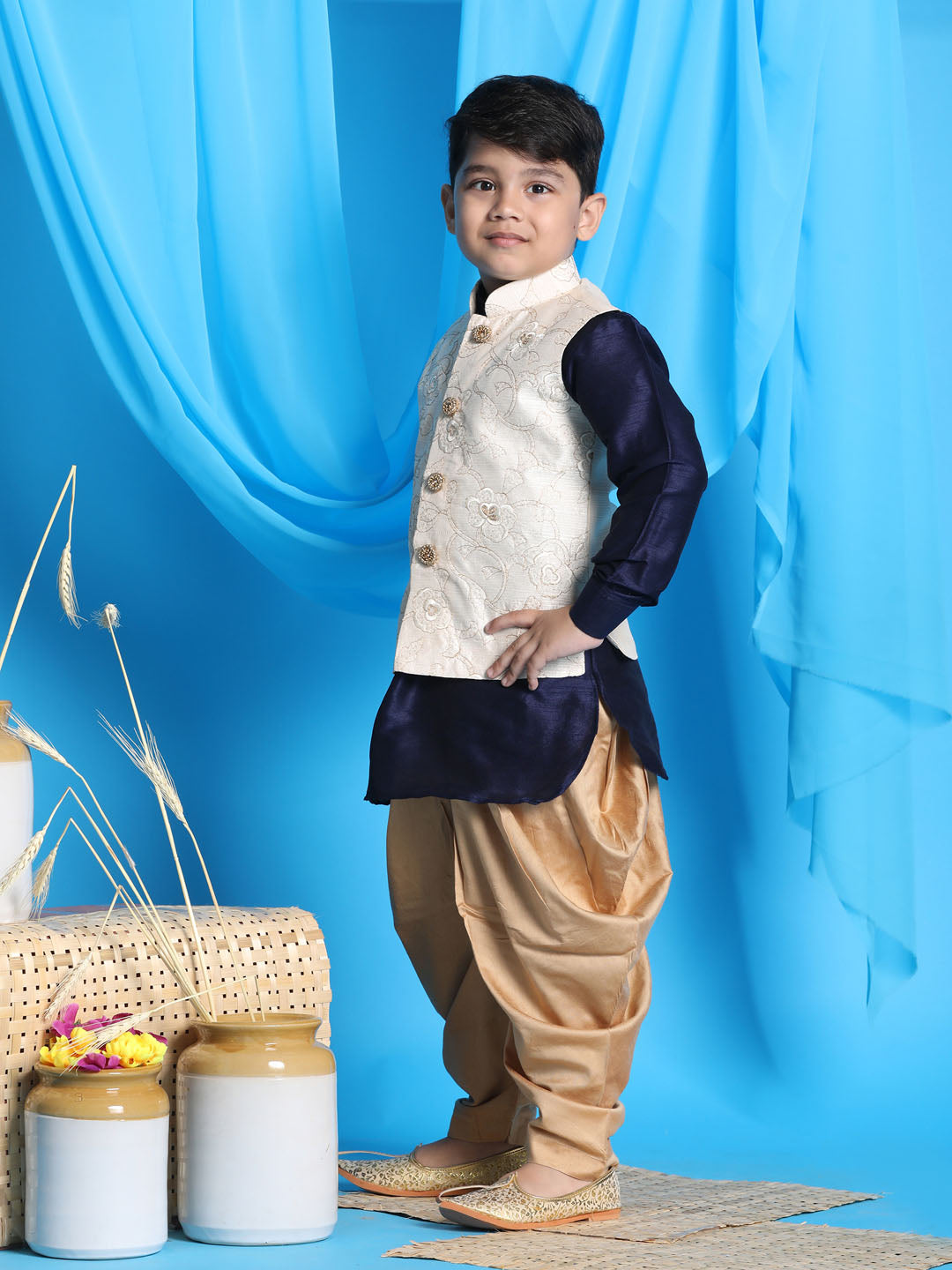 Vastramay boys beige embroidered nehru jacket with navy blue kurta and rose gold dhoti set 1