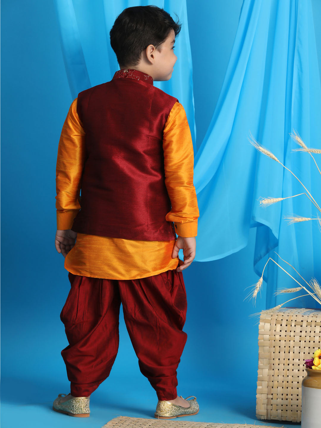 Vastramay boys maroon embroidered nehru jacket with orange kurta and black dhoti set