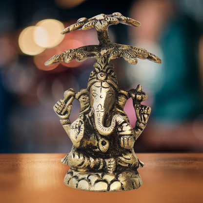 Brass Ganesh On Tree Statue