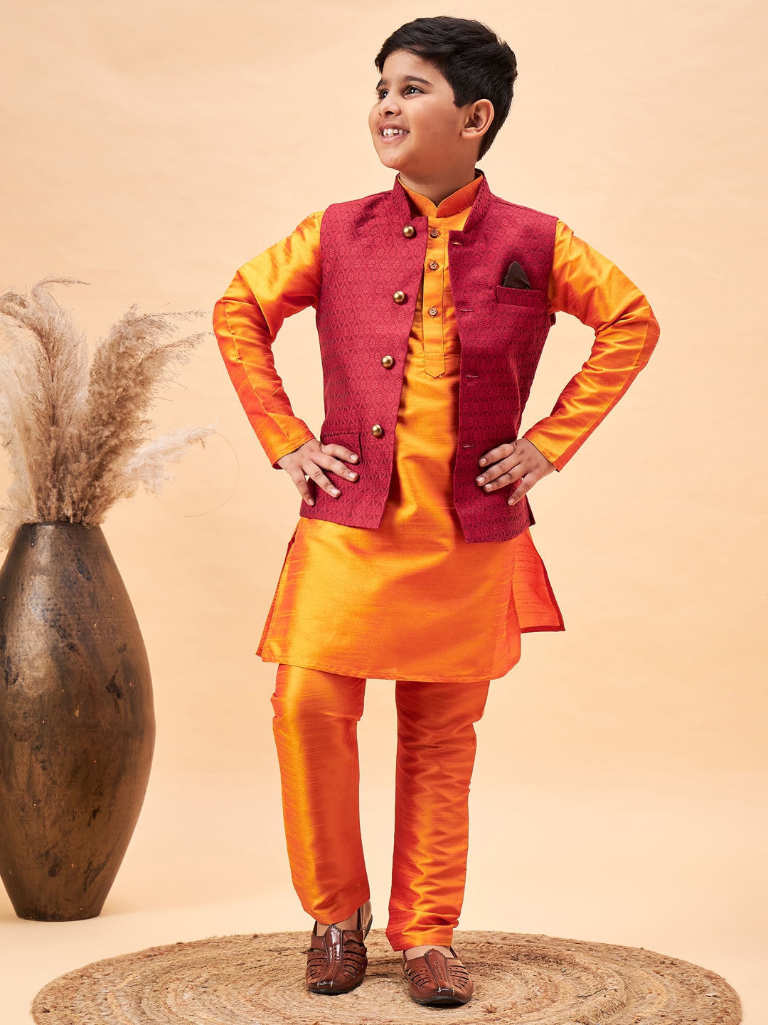 VASTRAMAY Boy's Maroon Woven Nehru Jacket With Orange Kurta And Pyjama Set