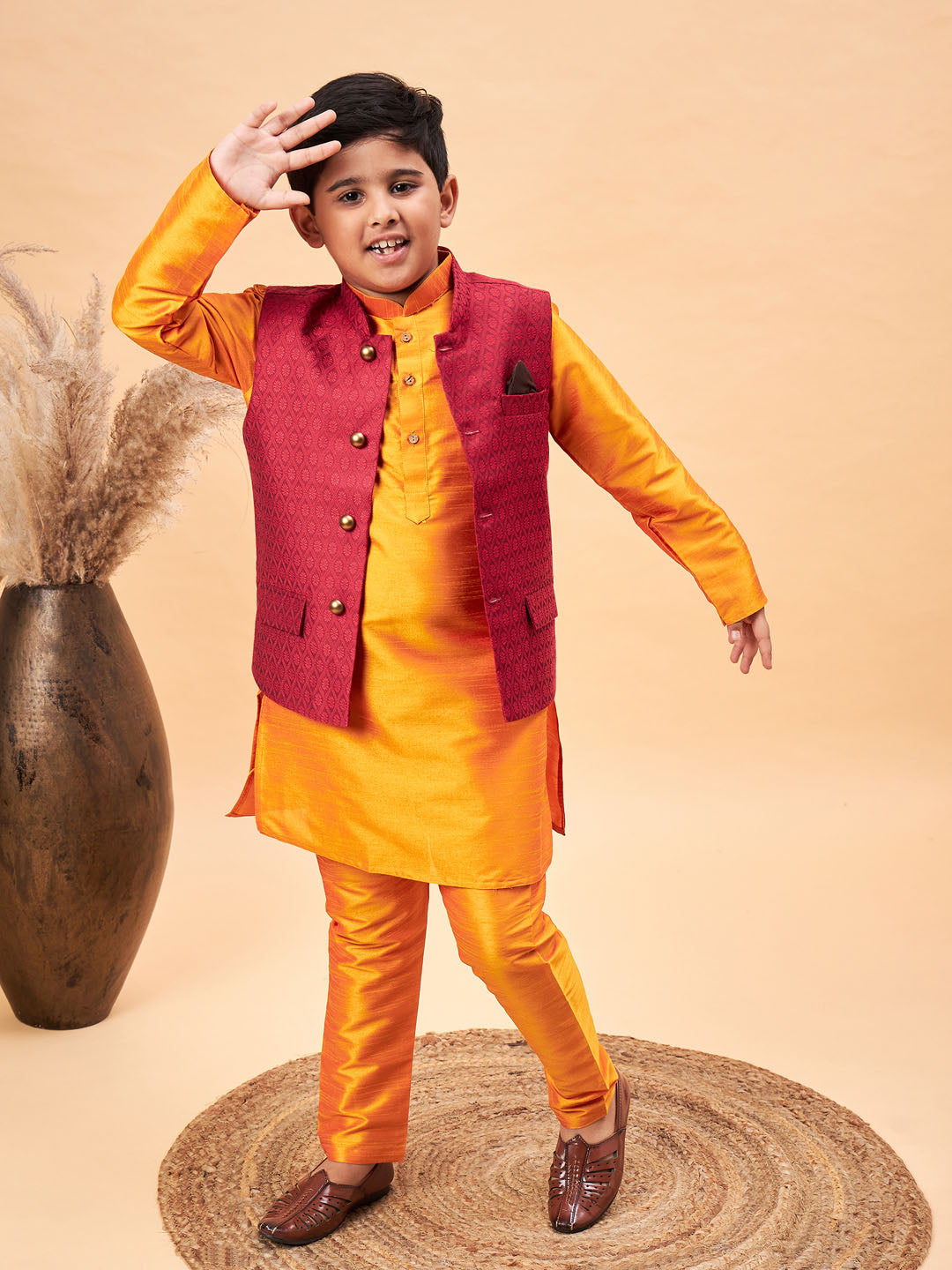 VASTRAMAY Boy's Maroon Woven Nehru Jacket With Orange Kurta And Pyjama Set