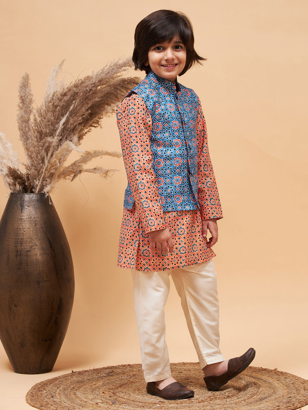 Vastramay boys orange printed kurta and cream pyjama set with blue nehru jacket