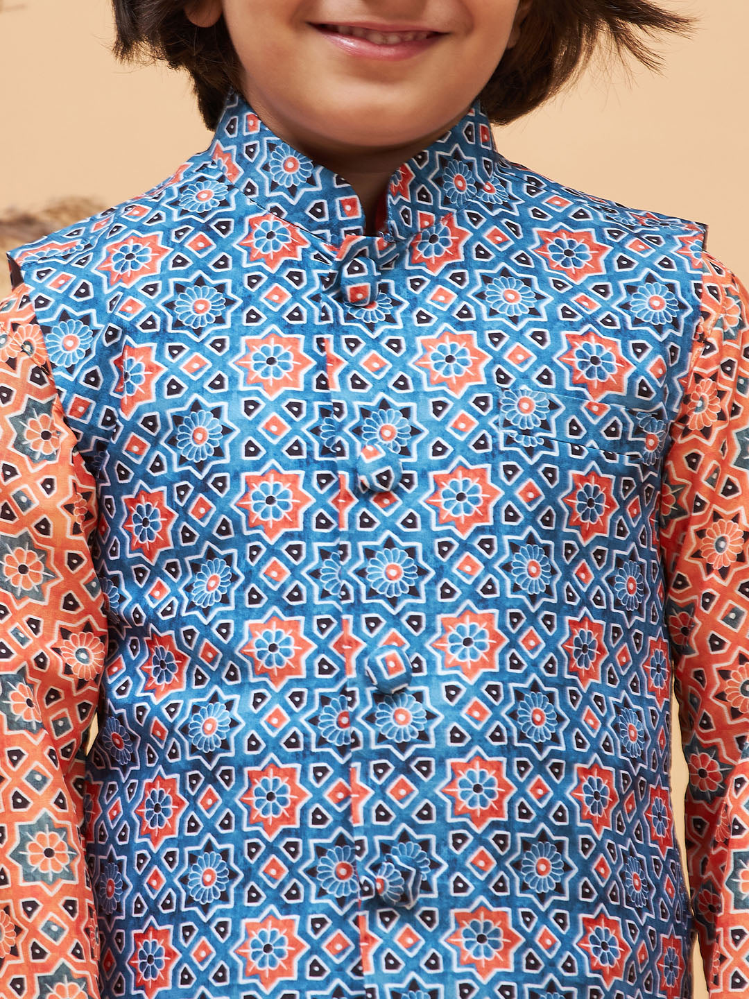 Vastramay boys orange printed kurta and cream pyjama set with blue nehru jacket