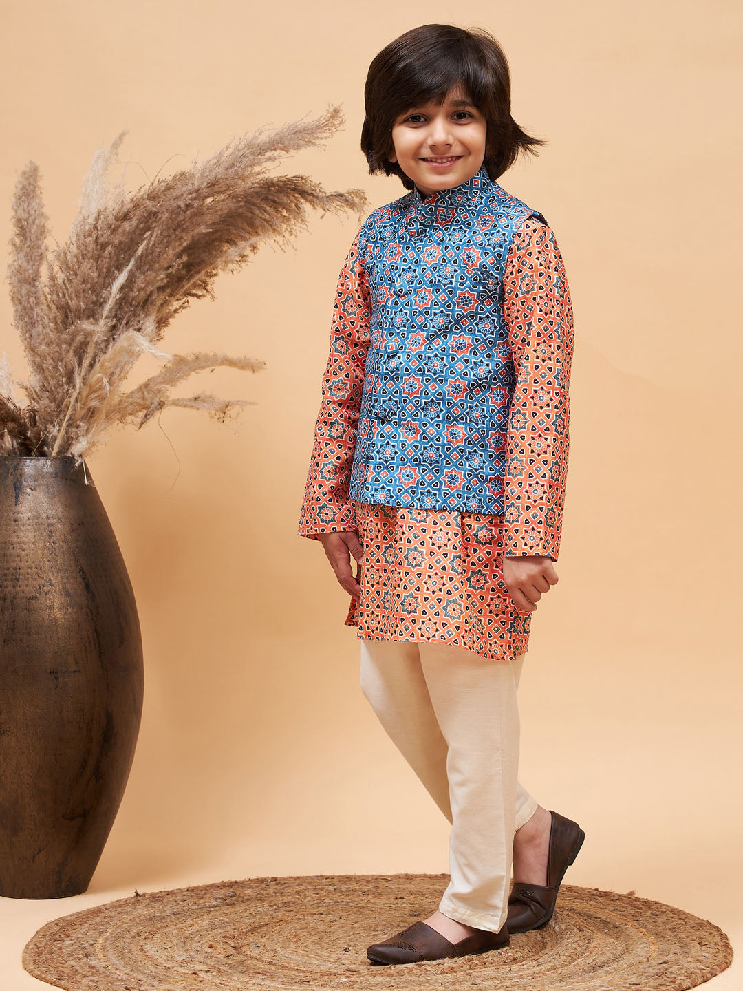 Vastramay boys orange printed kurta and cream pyjama set with blue nehru jacket