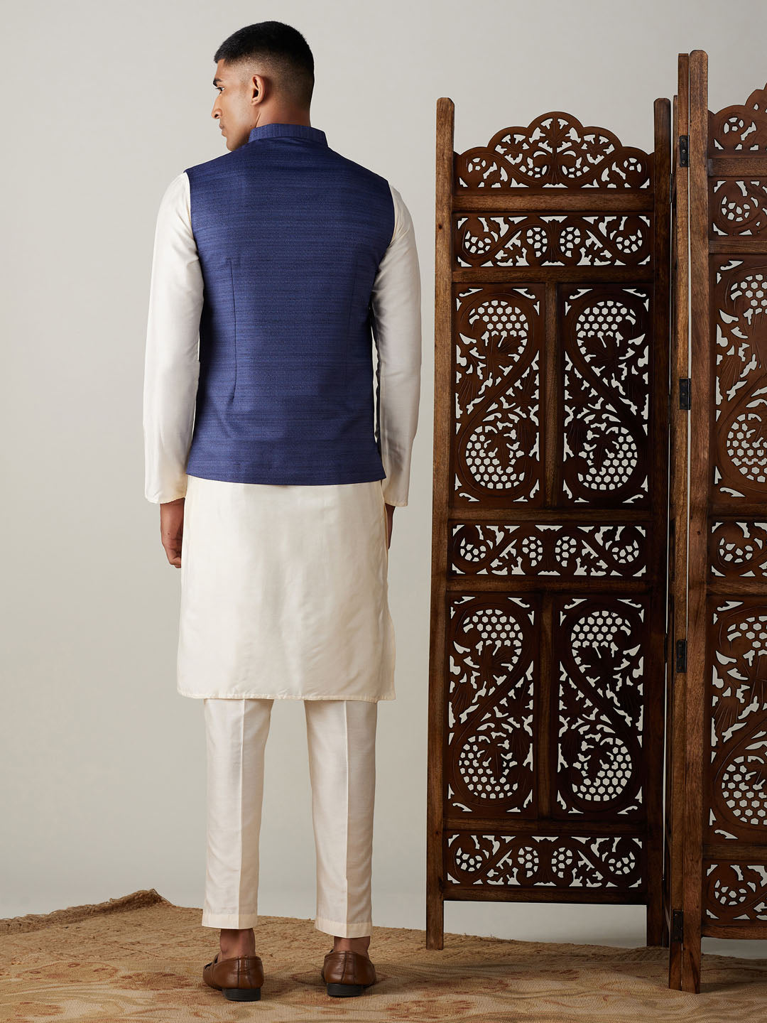 Vastramay navy blue cotton blend solid nehru jacket with cream kurta and pant set