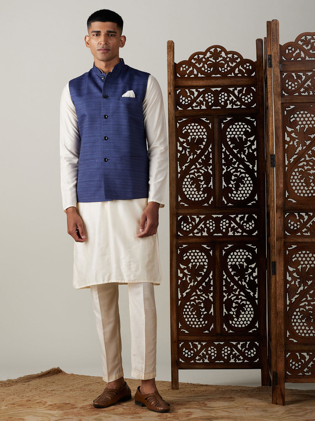 Vastramay navy blue cotton blend solid nehru jacket with cream kurta and pant set