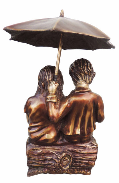 Brass Sitting Child With Umbrella Statue