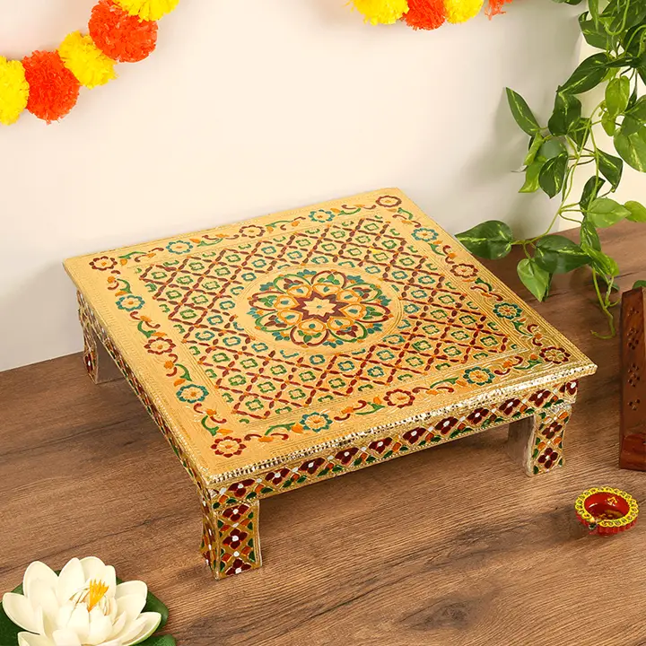 Multicolour pooja chowki on a wooden table