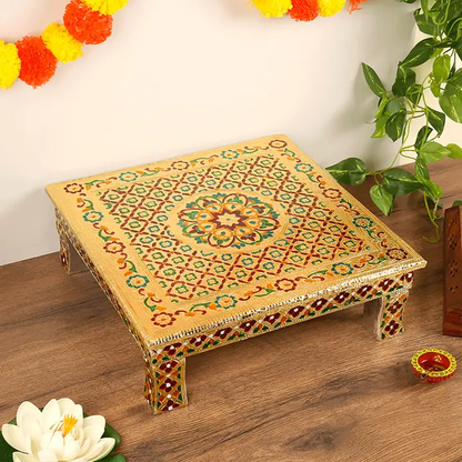 Multicolour pooja chowki on a wooden table